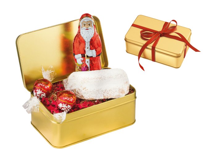 Goldene Geschenkbox mit einem Weihnachtsmann und Süßigkeiten, darunter Stollen und zartschmelzende Lindor Kugeln.